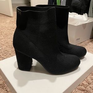 Women ankle boots. Black material, stretchy. Heel more than 3”